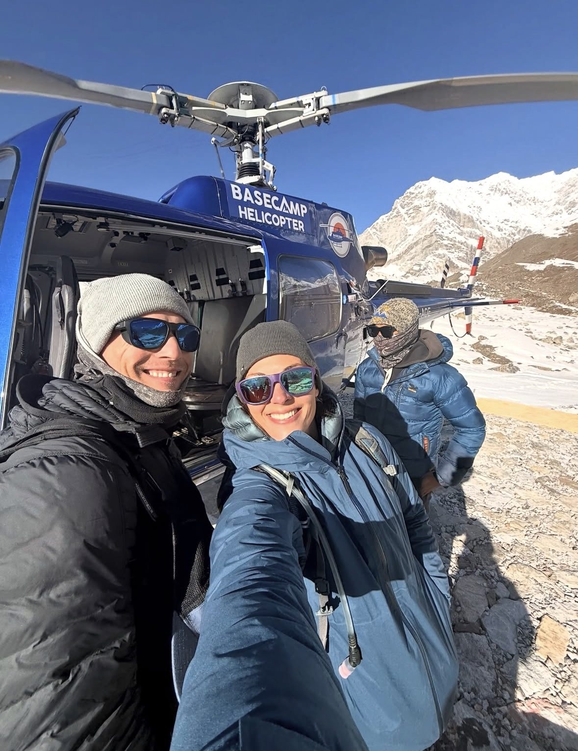 Helicopter flying over Everest Base Camp with snow-capped Himalayan peaks in the background