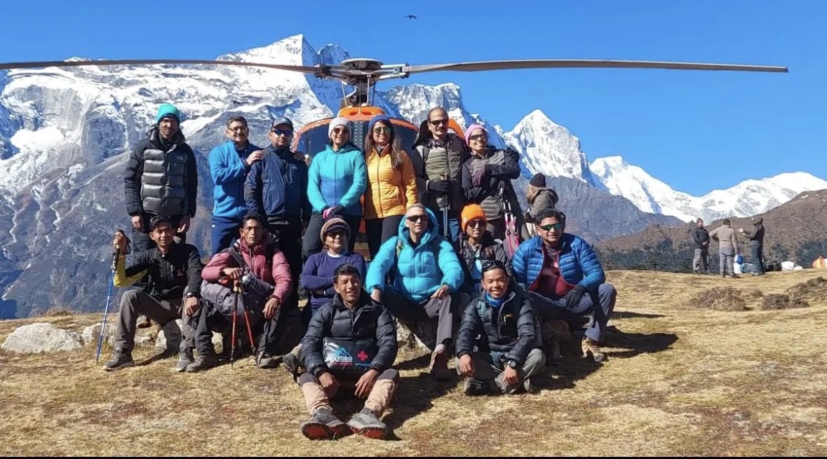 Warm mountaineering gear laid out ready for an Everest Base Camp helicopter tour day trip