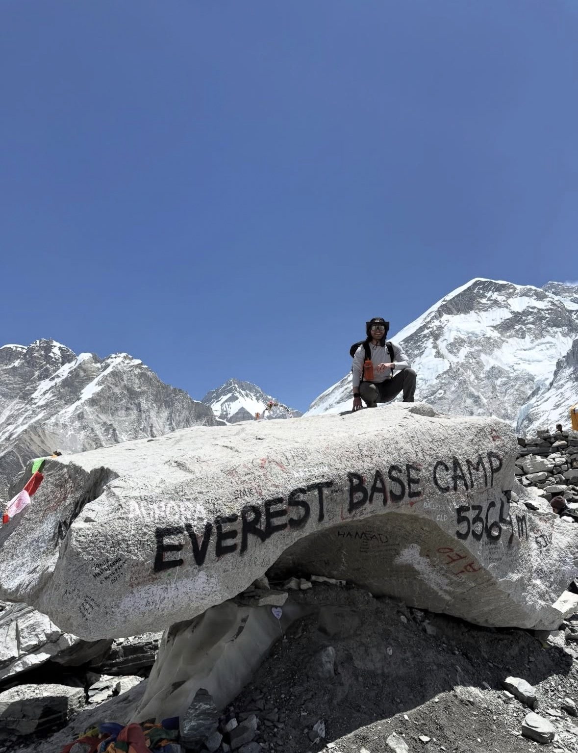 Sherpa guide and helicopter pilot in conversation before an Everest Base Camp helicopter tour briefing